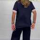 T-shirt à manches courtes avec bandes latérales et pantalon de jogging à jambes larges