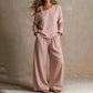 Ensemble élégant pour femme composé d'un haut asymétrique et d'un pantalon à jambes larges